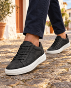 The Savona in Black, worn on a cobbled street