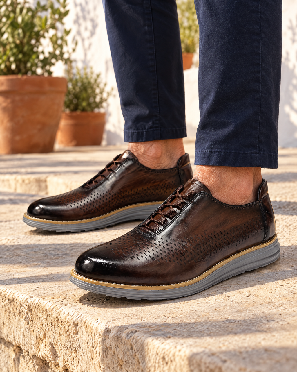 The Padova in Brown, worn on a limestone terrace