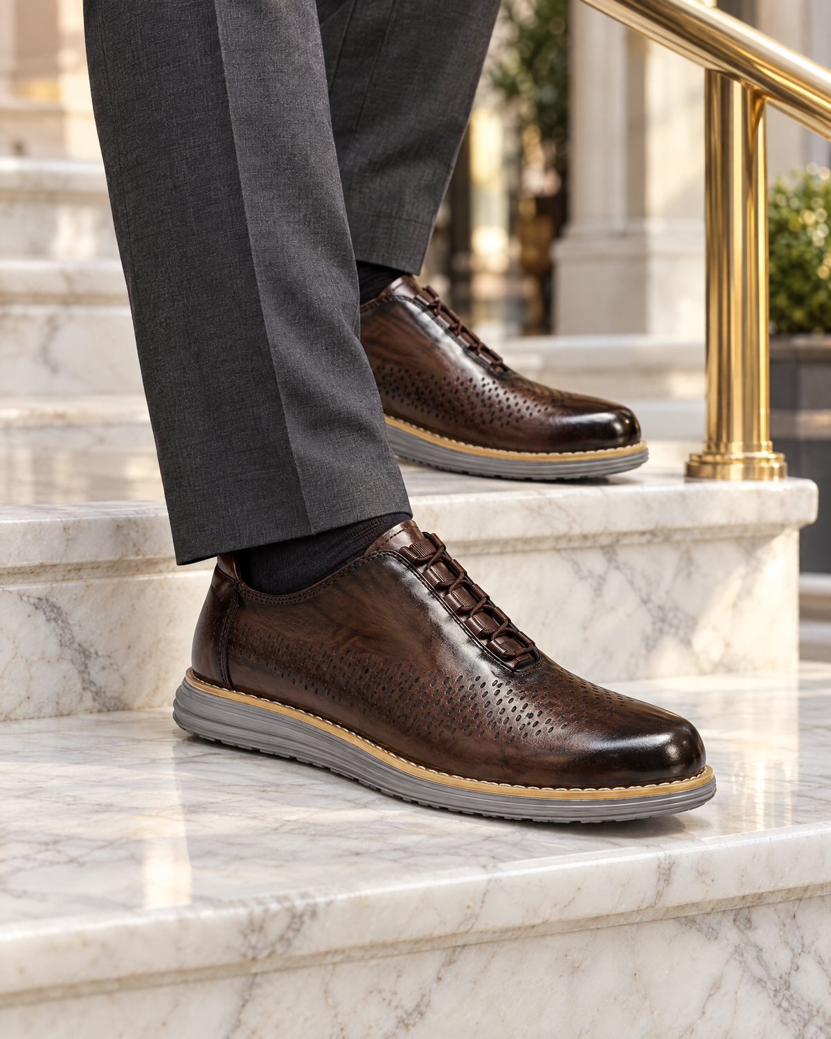 The Padova in Brown, worn with suit trousers on marble steps