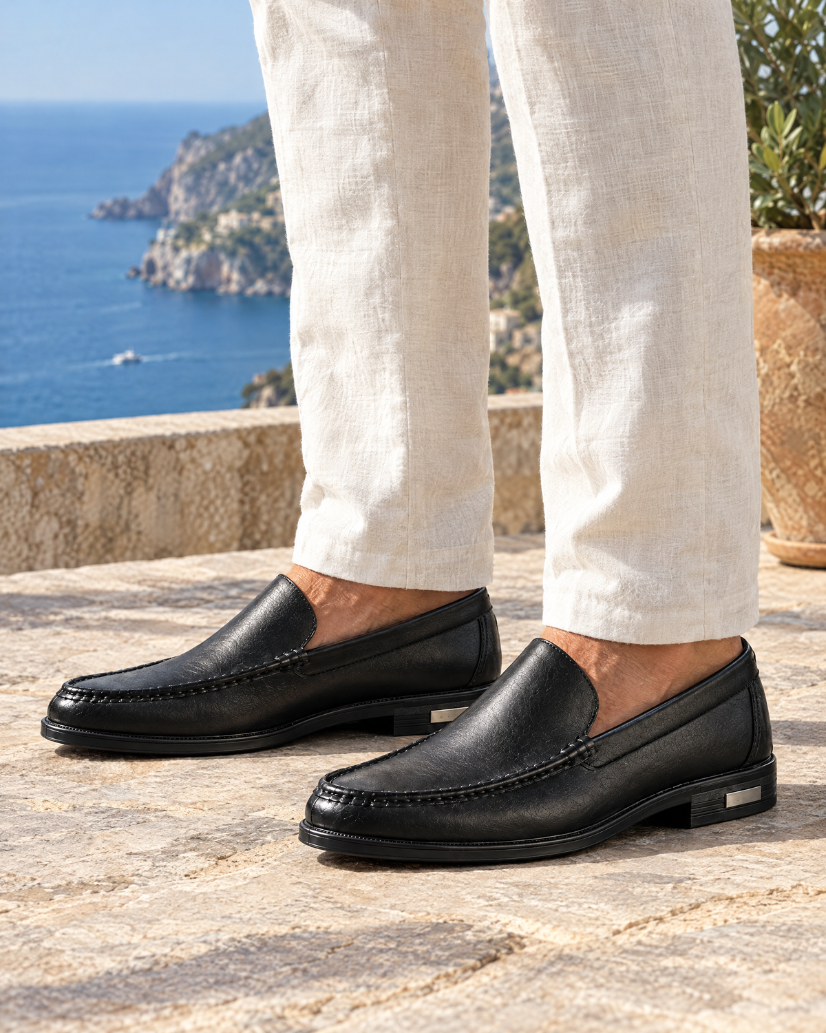 Como Leather Loafer in Black on a coast terrace - VIA NOVA