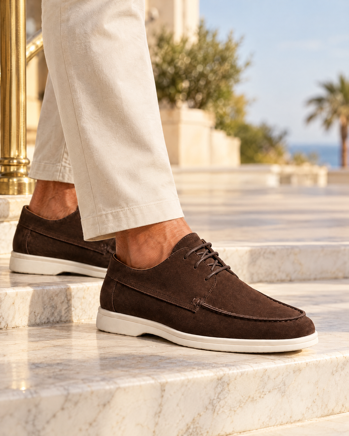 Brown suede derby shoes on marble steps