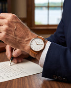 The Orta Leather Watch - On the wrist - navy blazer, writing desk