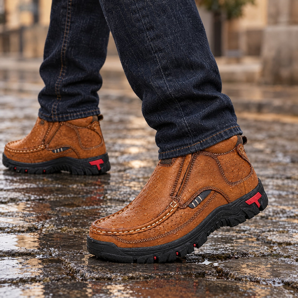 The Bormio worn on wet cobblestones with water beading on the leather